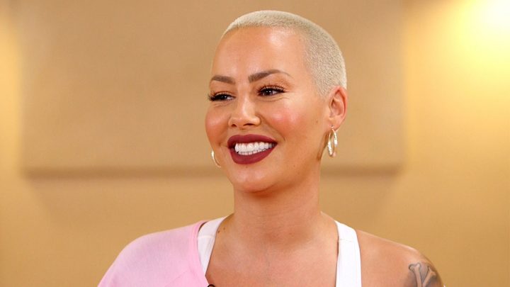 Amber Rose African American model with crew cut smiling bright shiny teeth