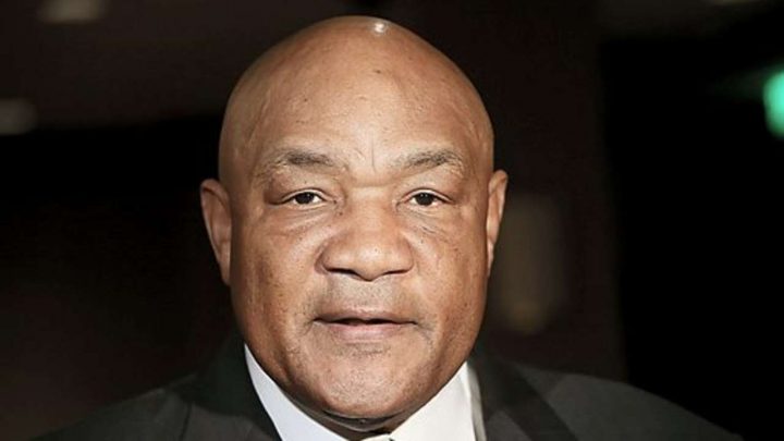 George Foreman African American boxing champion posing for photo
