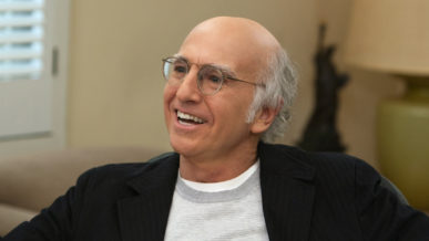 Larry David wearing glasses receding white hair