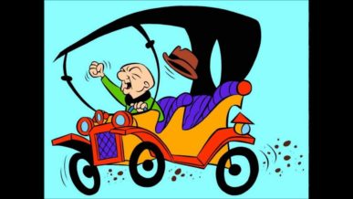 Mr Magoo bald cartoon character driving his car fist in the air