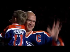 Mark Messier holding son and waving