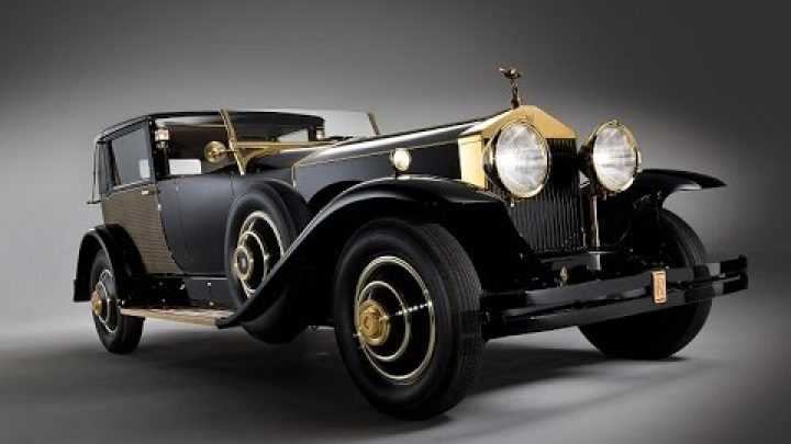 Henry Royce Bald People in History pictured is a classic old rolls royce car with gold trim