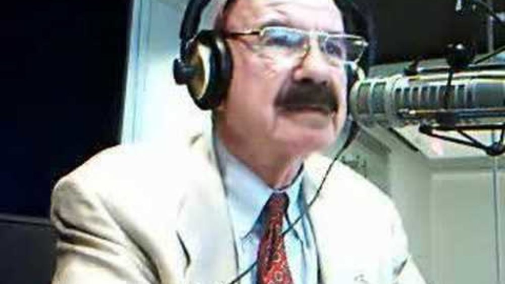 G Gordon Liddy talking into microphone