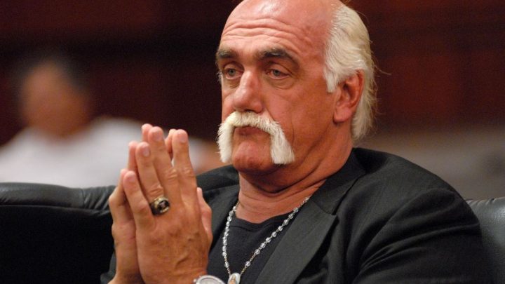 Hulk Hogan professional wrestler appearance in court hands together like he is praying