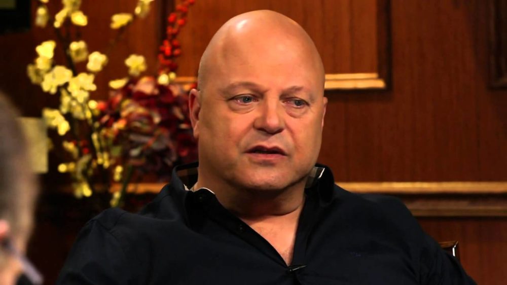 Michael Chiklis sitting